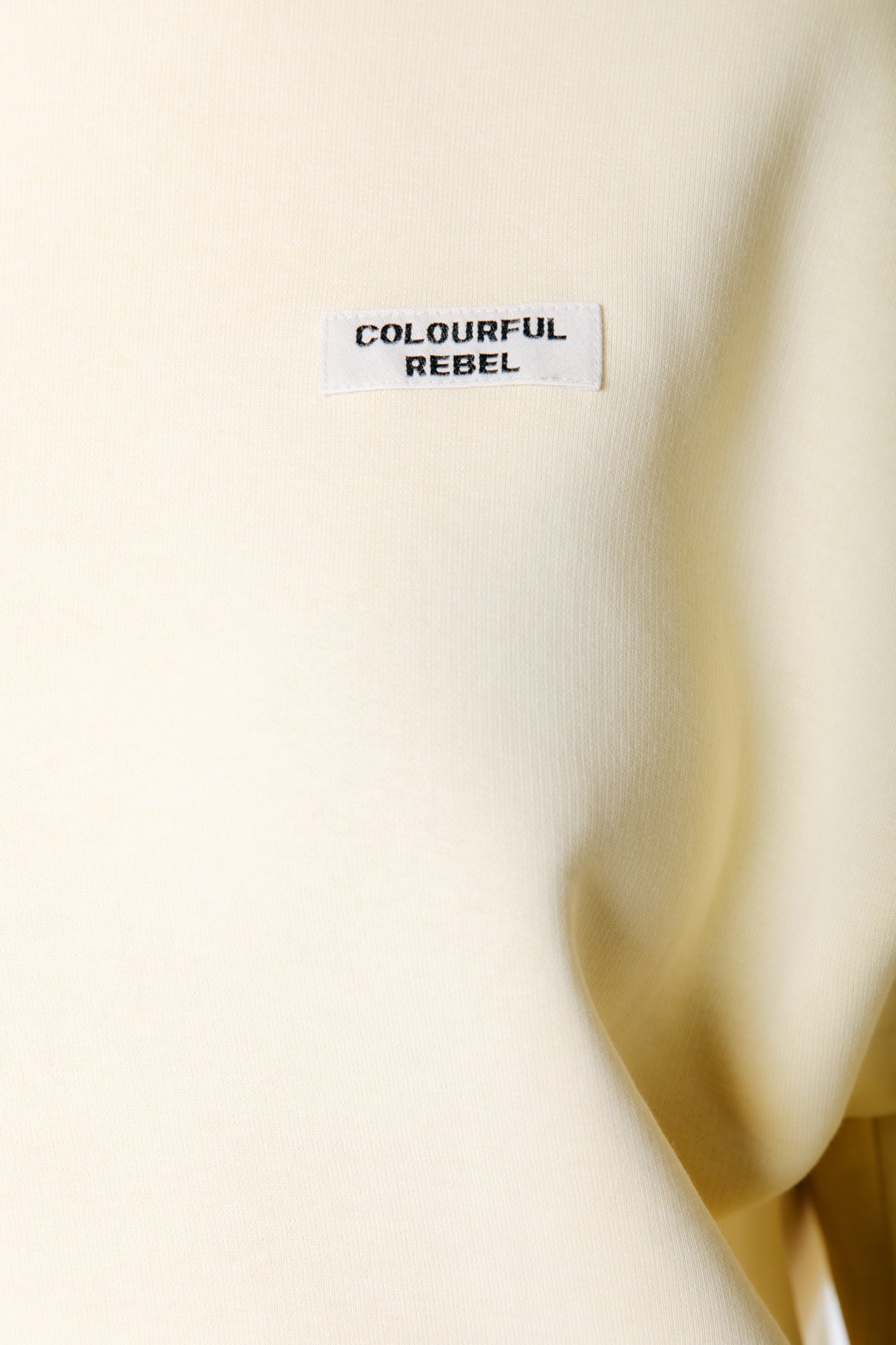 Uni Label Sweatshirt mit überschnittenen Schultern | Zartes Gelb